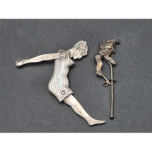 98 - An Art Deco white metal Figure of a Bather with engraved head and folding limbs, and a Figure of Pun... 