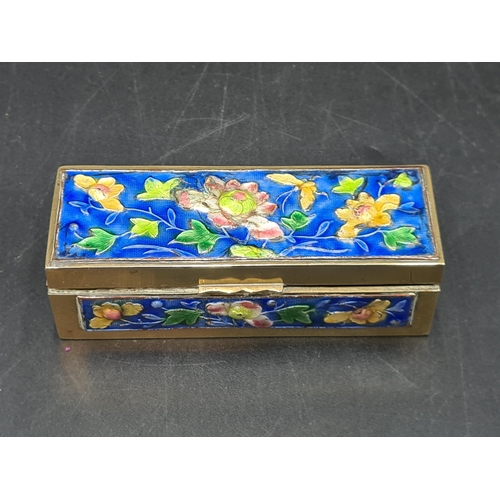 99 - A Chinese brass and enamel Stamp Box with floral design on a blue ground, 4 1/2in, A/F