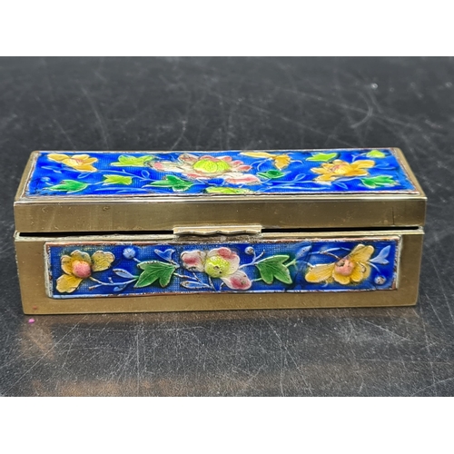 99 - A Chinese brass and enamel Stamp Box with floral design on a blue ground, 4 1/2in, A/F