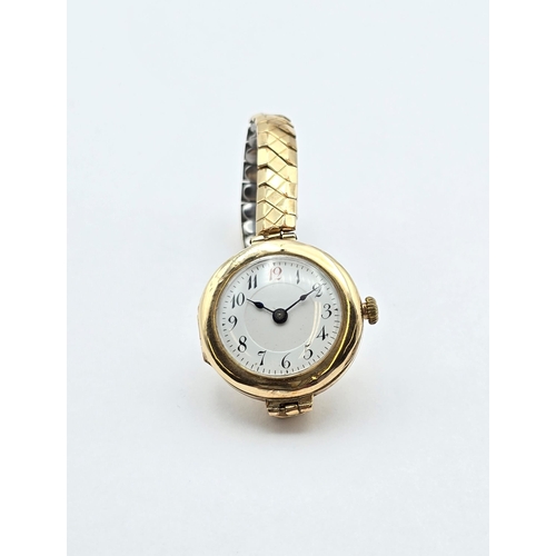 121 - A 1930s Lady's Wristwatch having white enamel dial with Arabic numbers in circular 9ct gold case on ... 