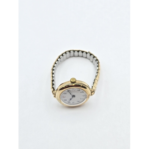 121 - A 1930s Lady's Wristwatch having white enamel dial with Arabic numbers in circular 9ct gold case on ... 