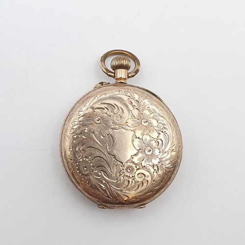 125 - A lady's Fob Watch the cream enamel dial having Roman numerals and applied gold decoration in 9ct go... 