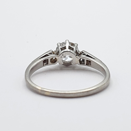 142 - A Diamond Ring, claw-set old-cut diamond in a rex collet with split tapered shoulders set small diam... 