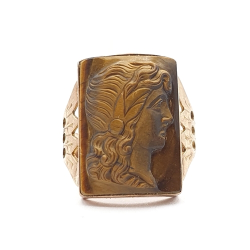 145 - A Victorian Carved Tiger's Eye Cameo Ring, rub-over set tiger's eye plaque carved with a woman in pr... 