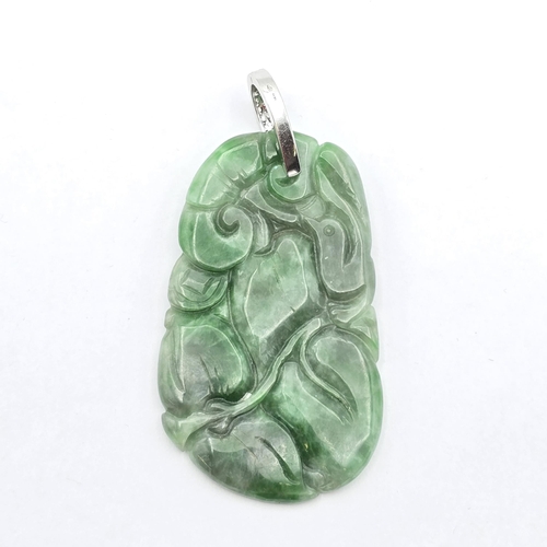 148 - A carved Jade Pendant with detachable white metal bail pavé-set two rows of single-cut diamonds stam... 