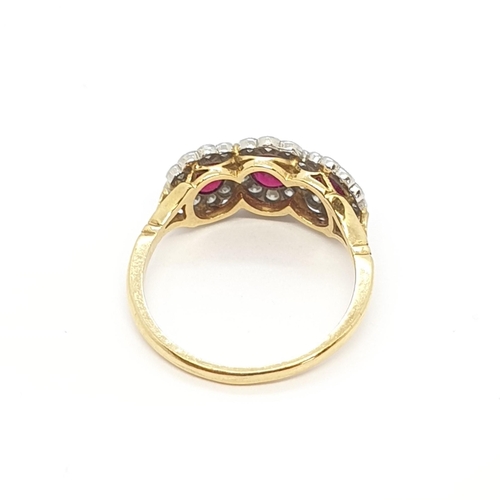 150 - A Ruby and Diamond Dress Ring, three oval mixed-cut rubies  surrounded by pavé-set single cut diamon... 