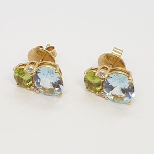 159 - A pair of Blue Topaz, Peridot and Diamond Earrings by Kiki McDonough, claw-set oval mixed-cut stones... 