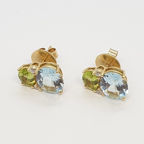 159 - A pair of Blue Topaz, Peridot and Diamond Earrings by Kiki McDonough, claw-set oval mixed-cut stones... 