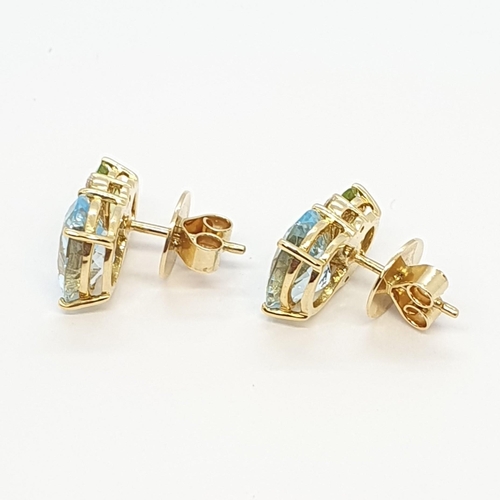 159 - A pair of Blue Topaz, Peridot and Diamond Earrings by Kiki McDonough, claw-set oval mixed-cut stones... 