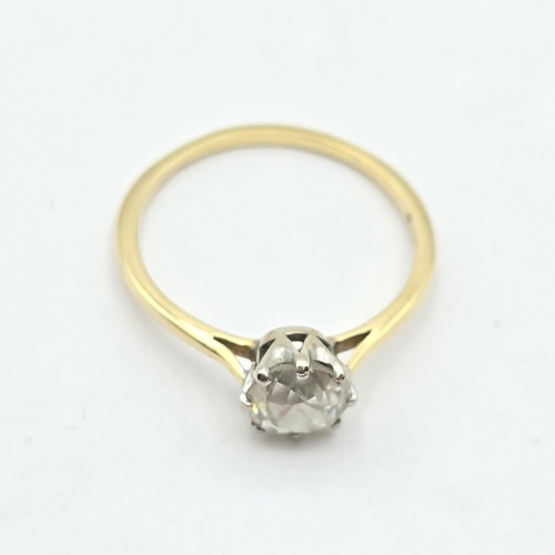 174 - A Diamond Solitaire Ring, claw-set cushion-cut diamond in white metal mount on yellow metal shank st... 