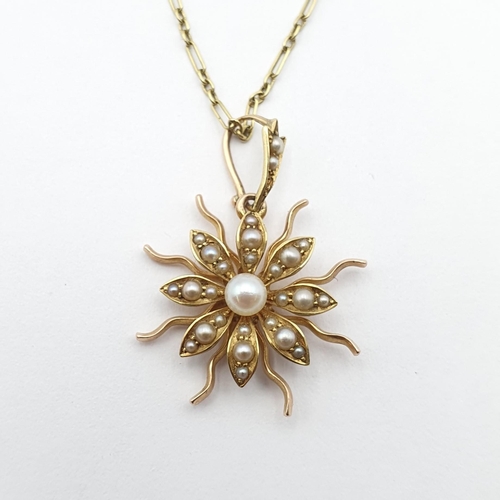 177 - A Victorian Flower Pendant set split pearls in unmarked gold metal on associated pearl-set bail 22mm... 