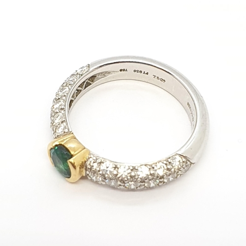 180 - An Emerald and Diamond Ring by Tiffany & Co, half-rubover-set round mixed-cut emerald in yellow gold... 