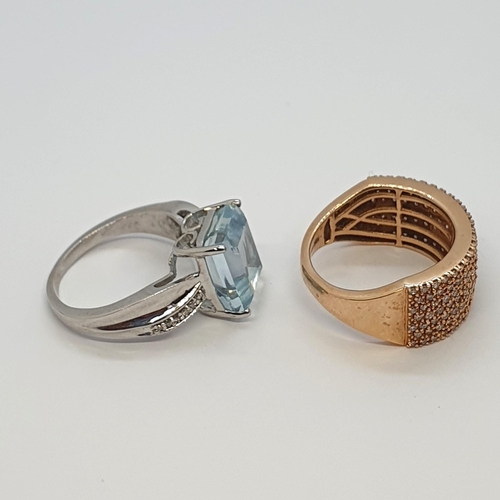 185 - An Aquamarine and Diamond Dress Ring in 18ct white gold and a pavé-set half hoop Diamond Dress ring ... 