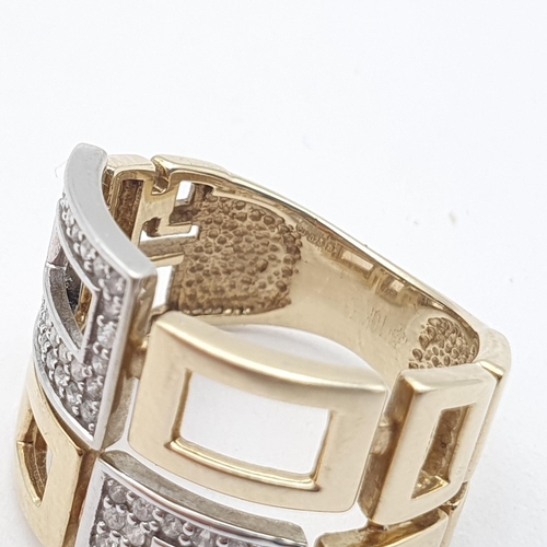 199 - A geometric design gold and diamond Ring, pavé-set brilliant-cut diamonds set in white 9ct gold pier... 