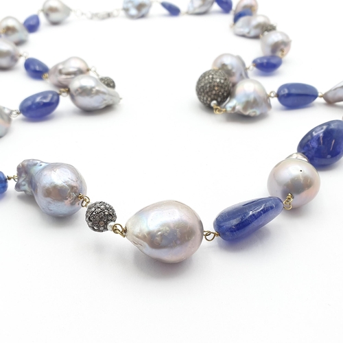 200 - An opera length Baroque Pearl, Tanzanite and Diamond Necklace, baroque pearls strung on yellow metal... 