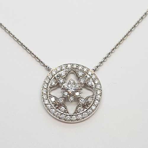 204 - A Diamond Roundel Necklace by Mappin & Webb, pavé-set brilliant-cut diamonds in white gold roundel w... 