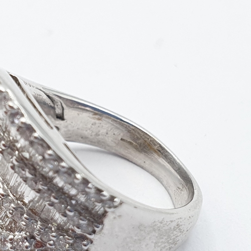 213 - A Diamond Dress Ring, ballerina style half-hoop of pavé-set baguette-cut and brilliant-cut diamonds ... 