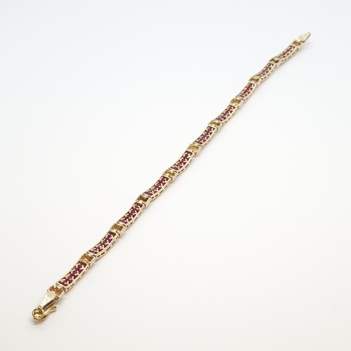 221 - A Ruby and Diamond Line bracelet, channel-set calibré-cut rubies set between links of illusion-set s... 