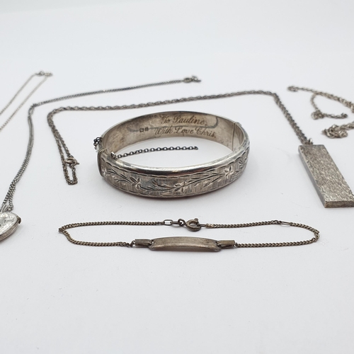 231 - A small group of Silver Jewellery to include a vintage engraved Silver Bangle, a Silver Ingot on cha... 