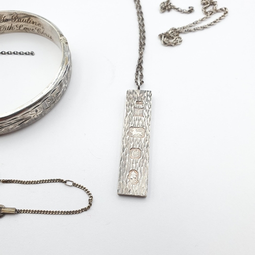 231 - A small group of Silver Jewellery to include a vintage engraved Silver Bangle, a Silver Ingot on cha... 