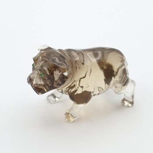 253 - A small carved smokey quartz Figure in the form of a Bulldog, with pair of inset green glass eyes, 1... 