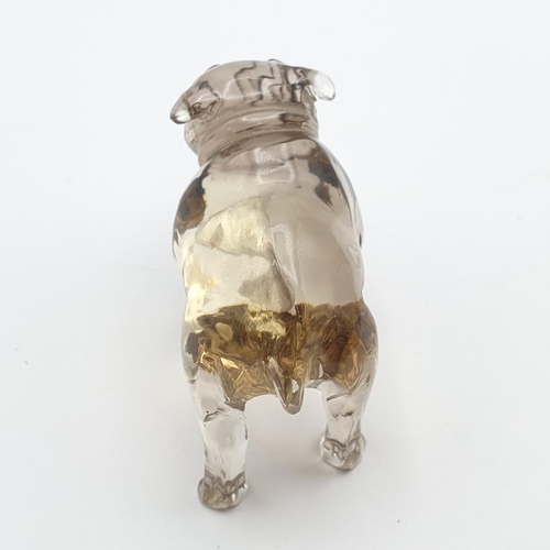 253 - A small carved smokey quartz Figure in the form of a Bulldog, with pair of inset green glass eyes, 1... 