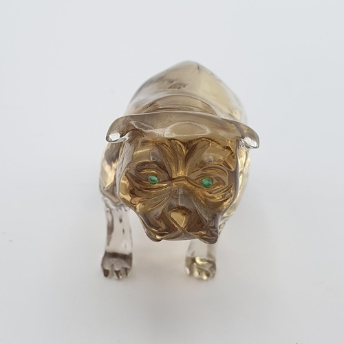 253 - A small carved smokey quartz Figure in the form of a Bulldog, with pair of inset green glass eyes, 1... 