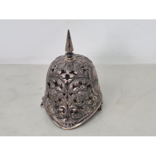 103 - An Unusual Victorian silver Table Bell in the form of a pickle helmet with floral and scroll piercin... 