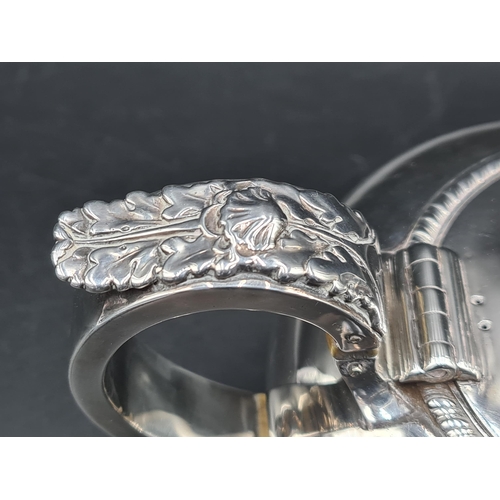 12 - A George IV silver small Teapot of compressed circular form with leafage scroll handle, flower finia... 
