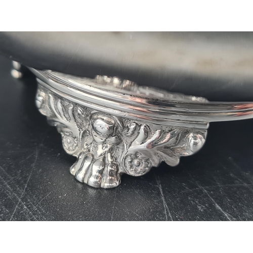 12 - A George IV silver small Teapot of compressed circular form with leafage scroll handle, flower finia... 