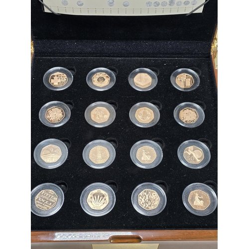 274 - Royal Mint 1969-2009 40th Anniversary UK Gold Proof 50p Collection (16 coins), in fitted polished wo... 