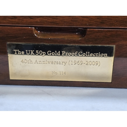 274 - Royal Mint 1969-2009 40th Anniversary UK Gold Proof 50p Collection (16 coins), in fitted polished wo... 