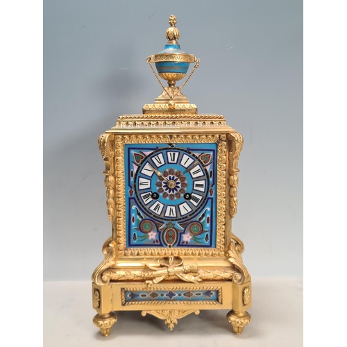 281 - A 19th century gilt metal and champlevé Mantel Clock with urn finial above the rectangular enamelled... 