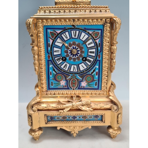 281 - A 19th century gilt metal and champlevé Mantel Clock with urn finial above the rectangular enamelled... 