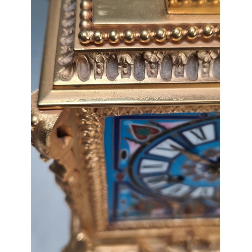 281 - A 19th century gilt metal and champlevé Mantel Clock with urn finial above the rectangular enamelled... 