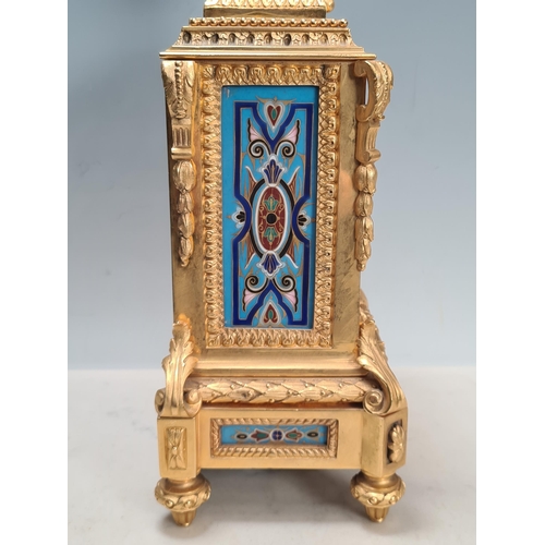 281 - A 19th century gilt metal and champlevé Mantel Clock with urn finial above the rectangular enamelled... 