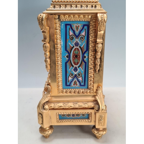 281 - A 19th century gilt metal and champlevé Mantel Clock with urn finial above the rectangular enamelled... 