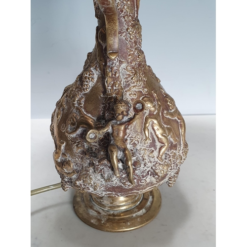 293 - A brass Table Lamp decorated numerous figures in relief