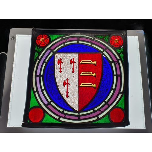 294 - A stained glass leaded Panel bearing a Coat of Arms, 11. 1/2 in. square.