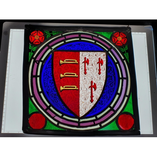 294 - A stained glass leaded Panel bearing a Coat of Arms, 11. 1/2 in. square.