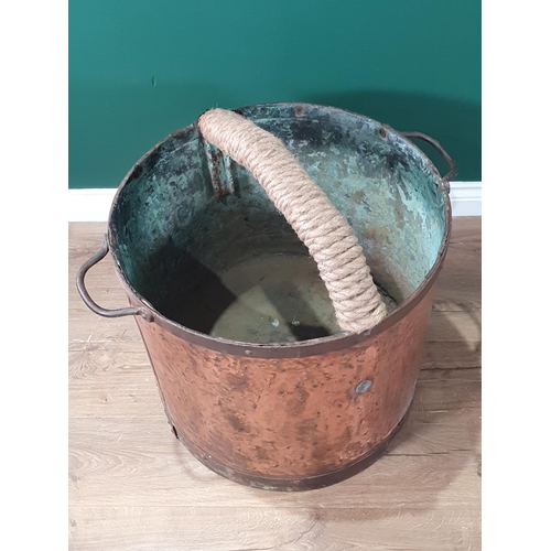 297 - A large French twin-handled copper Pot with riveted rims and later rope covered central handle, A/F,... 