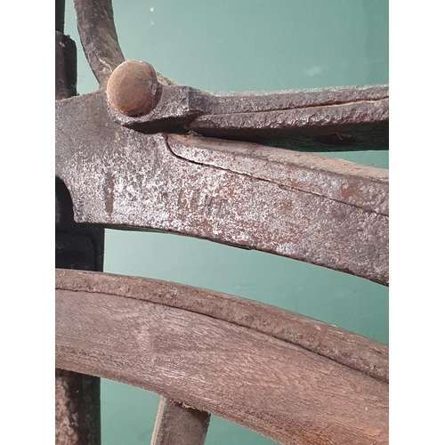 300 - A French Boneshaker Bicycle with turned wooden Handlebars, iron saddle and framework, wooden spoked ... 