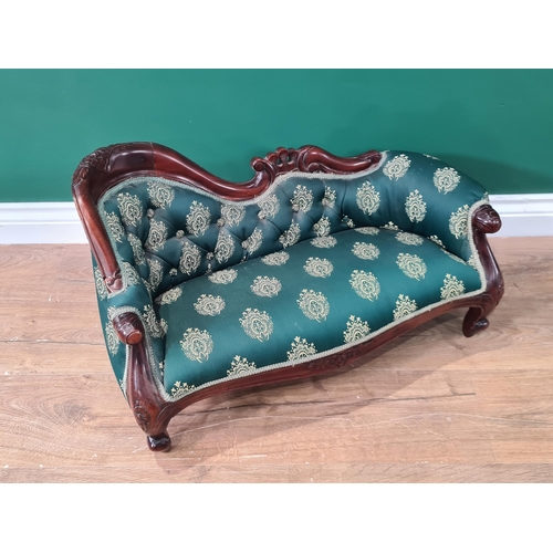 307 - A Victorian style mahogany framed Child's Chaise Longue with green button upholstery on cabriole sup... 