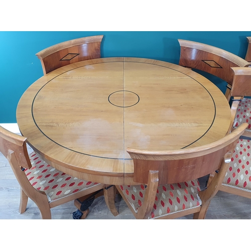 309 - A Biedermeier style satinwood Dining Table and six Chairs, the extending table, 4ft closed, having o... 