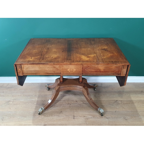 312 - A Regency rosewood Sofa Table having satinwood inlay and stringing, fitted two drawers on lyre end s... 