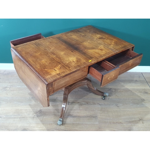 312 - A Regency rosewood Sofa Table having satinwood inlay and stringing, fitted two drawers on lyre end s... 