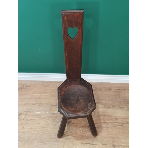 317 - A 19th Century Welsh oak Spinning Chair with heart pierced back and dished seat raised on primitive ... 