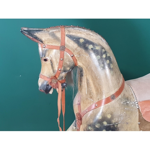 320 - A Victorian carved and painted dapple gray Rocking Horse in the manner of F.H. Ayres, with leather b... 