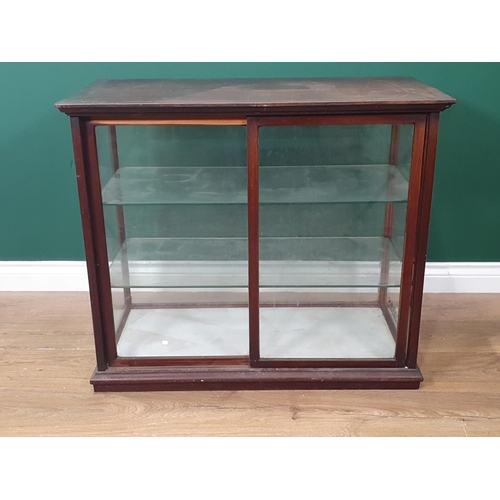 329 - A mahogany framed glazed Shop Display Cabinet with moulded cornice and plinth, a pair of glazed slid... 