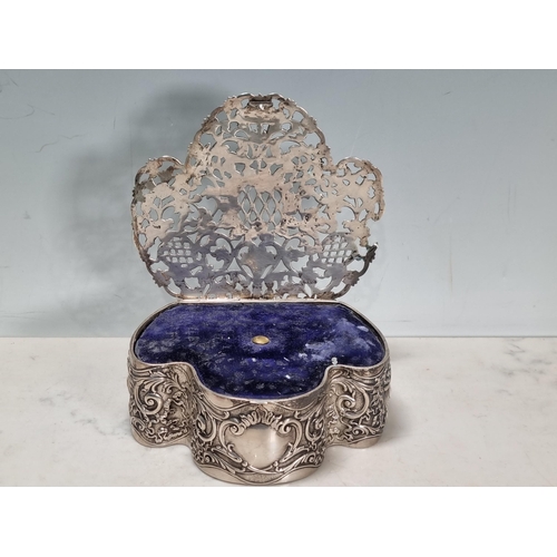 33 - An Edward VII silver Trinket Box, the pierced hinged lid with vase of flowers and floral scrolls, th... 